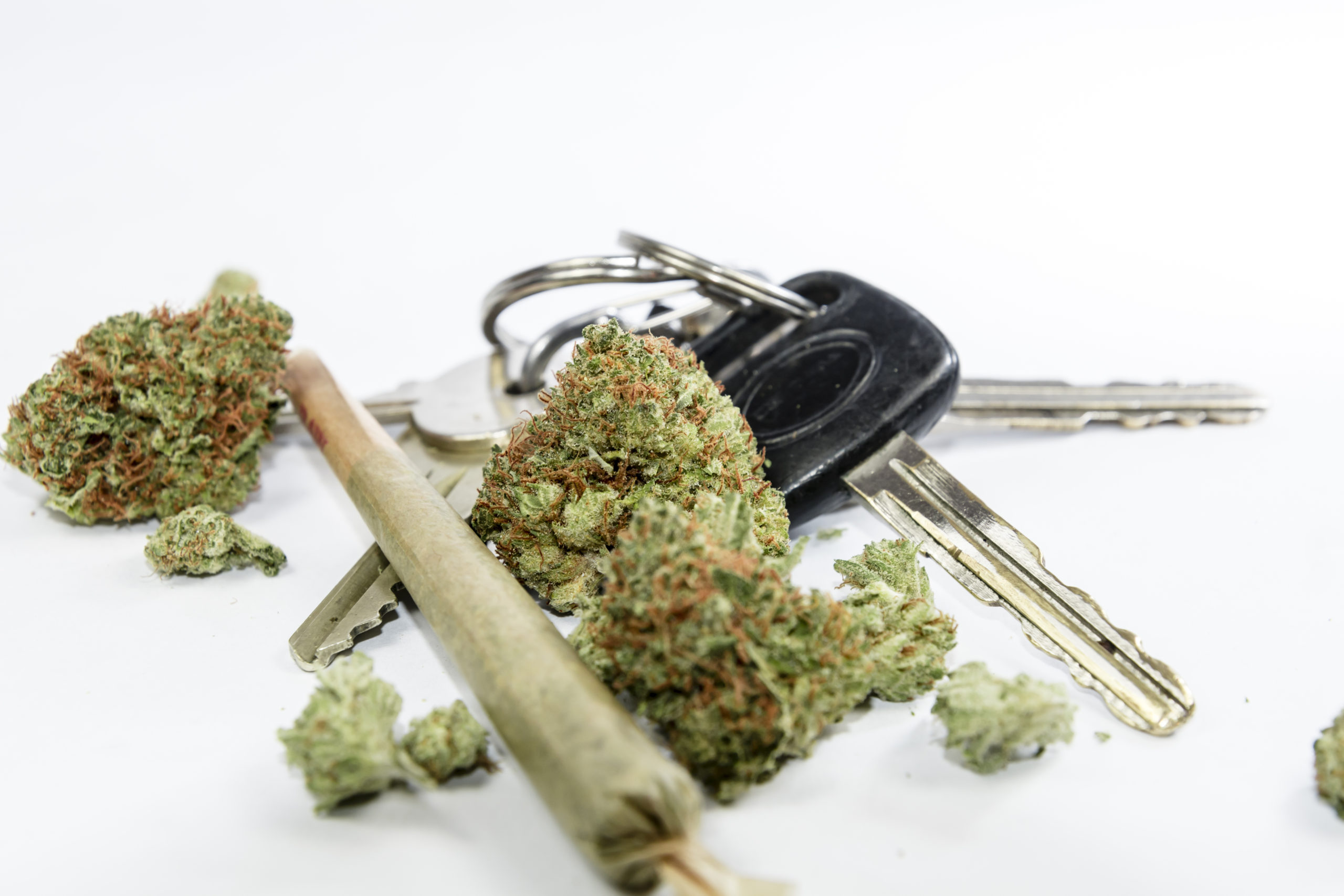 image of marijuana laying beside car keys