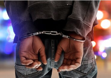 man handcuffed after being arrested for marijuana possession in Las Vegas