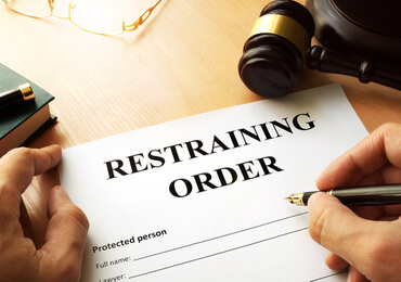restraining order document on top of the table