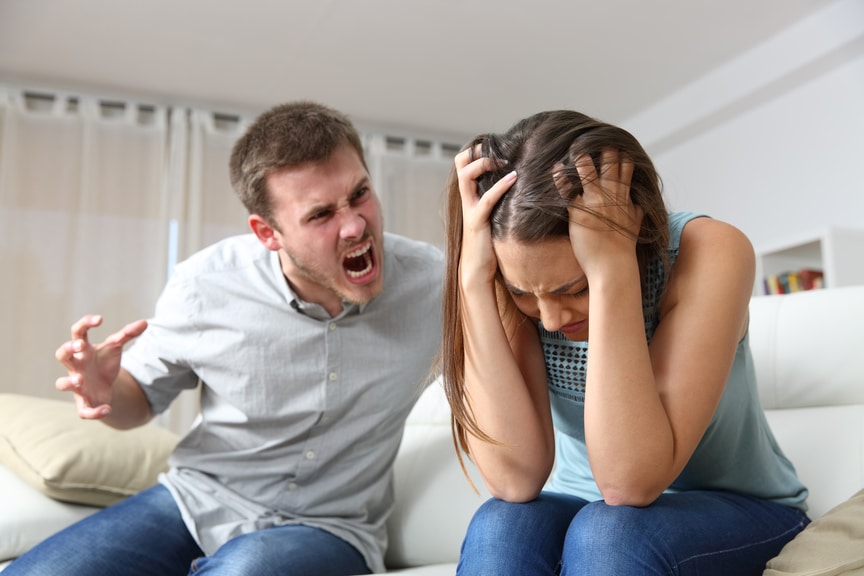 man verbally abusing woman