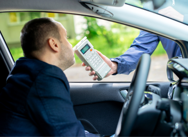 a driver is being subject to a breathalyzer for suspicious DUI in Nevada