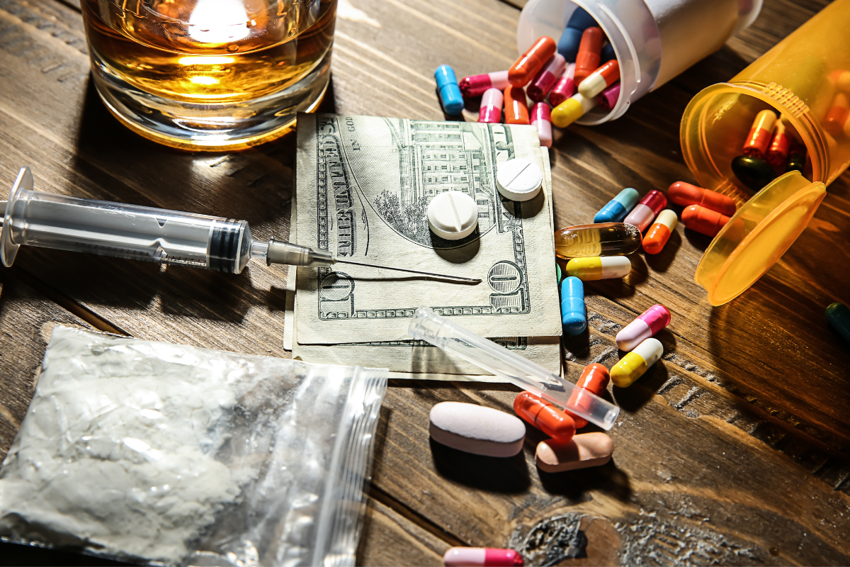 drugs and rug araphernalias on a table - concept of Drug Paraphernalia Possession Defense Attorney